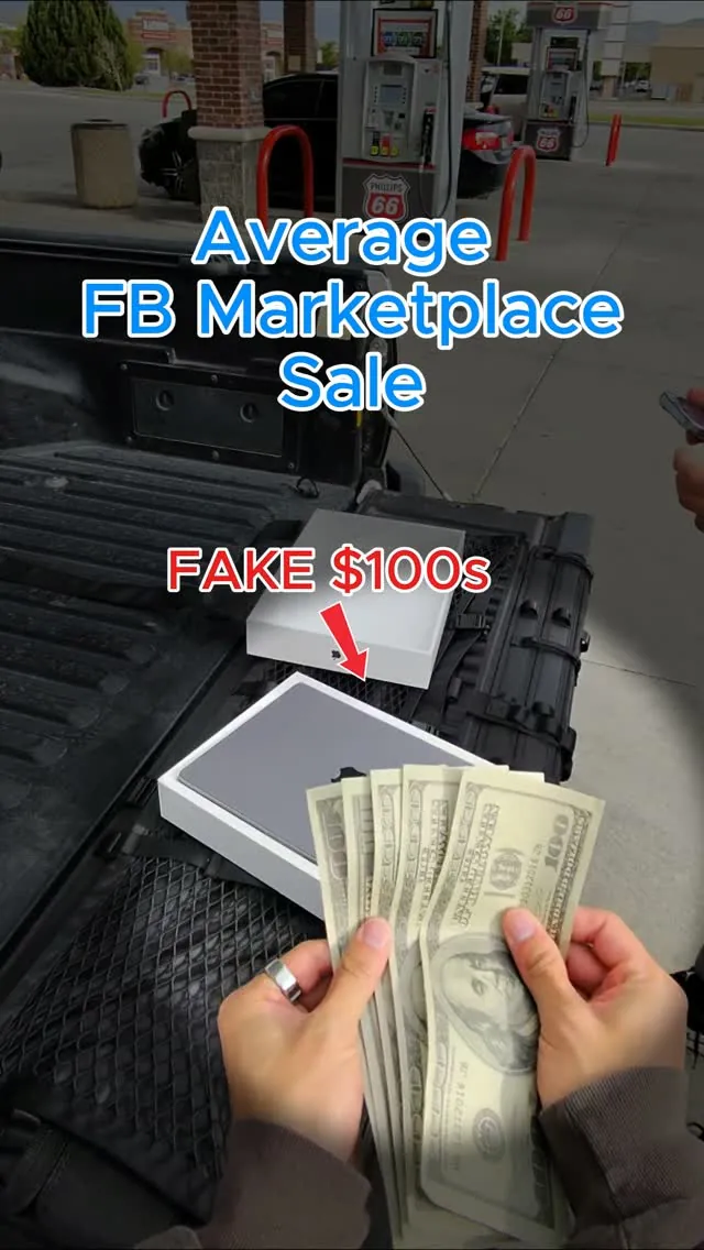 Counting a fan of hundred dollar bills over a truck tailgate